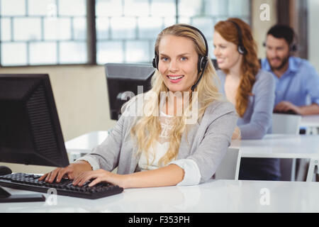 Portrait of beautiful operator working on computer Stock Photo