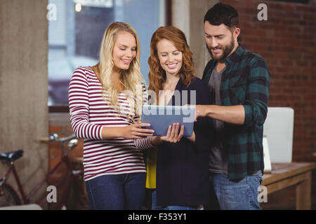 Man pointing towards tablet Stock Photo