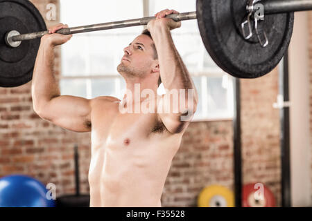 Muscular man doing weightlifting Stock Photo
