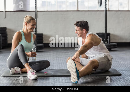 Sports couple taking break and talking together Stock Photo