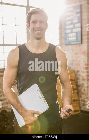 Portrait of an instructor holding clip board Stock Photo