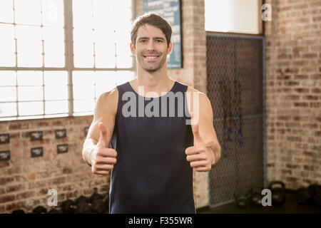 Portrait of a man showing thumbs up Stock Photo