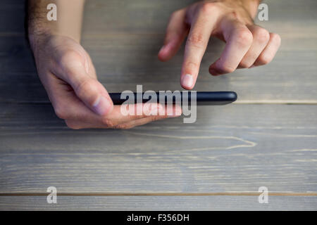 Person holding and using smart phone Stock Photo
