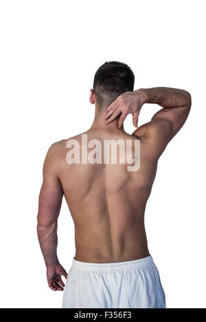 Rear view of a man suffering from neck pain Stock Photo