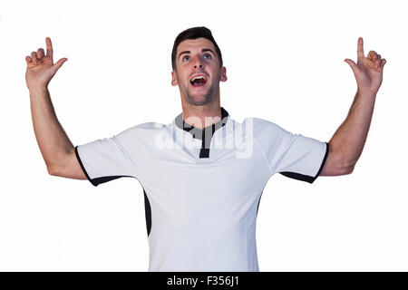 Surprised rugby player pointing up Stock Photo