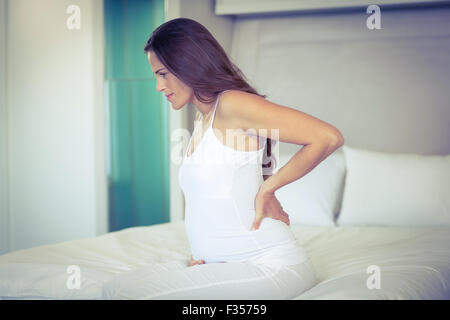 Pregnant woman with back pain Stock Photo