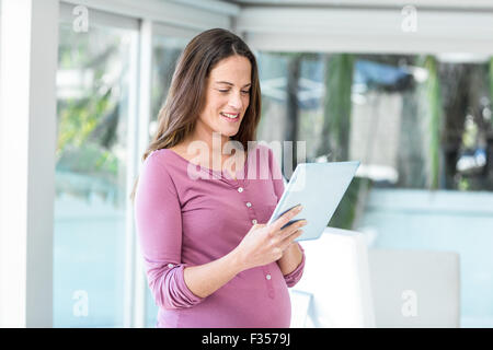Happy businesswoman using digital tablet Stock Photo