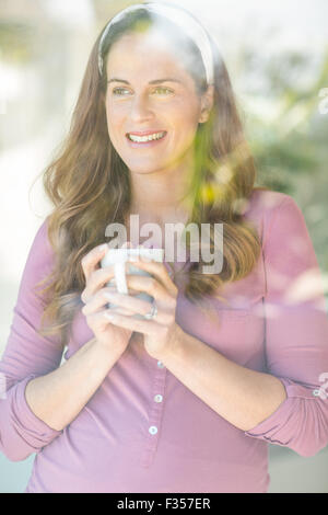 Happy woman with coffee cup Stock Photo