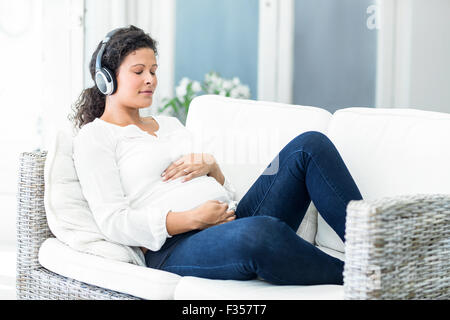 Happy woman listening to music with closed eyes Stock Photo