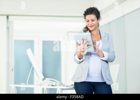 Confident businesswoman using digital tablet Stock Photo
