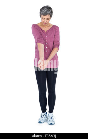 Mature woman stretching Stock Photo