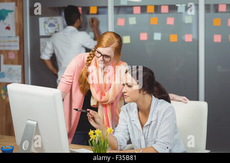 Serious businesswomen using computer Stock Photo