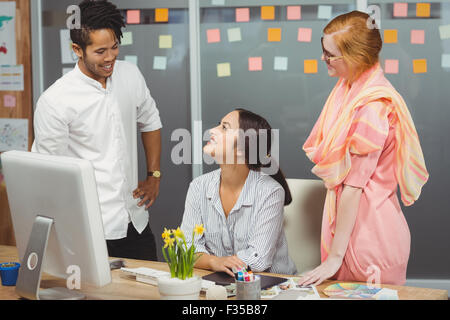 Happy business people using computer in office Stock Photo