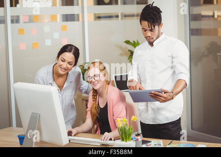 Business people using technologies in office Stock Photo