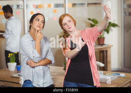 Businesswomen discussing in office Stock Photo