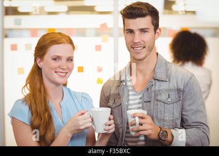 Portrait of business people having coffee break Stock Photo
