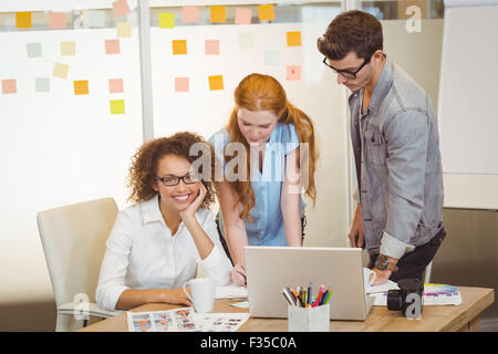 Businesswoman with colleagues in meeting Stock Photo