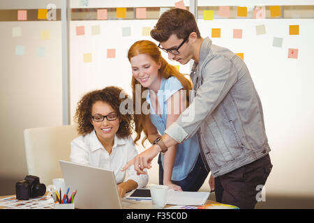 Businessman pointing on laptop Stock Photo