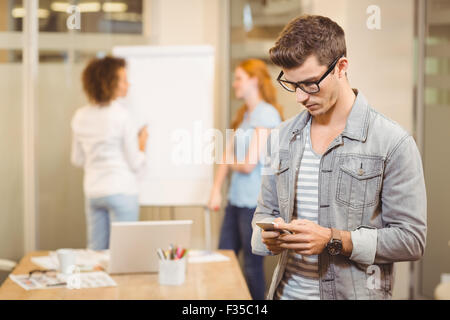 Businessman texting on phone Stock Photo
