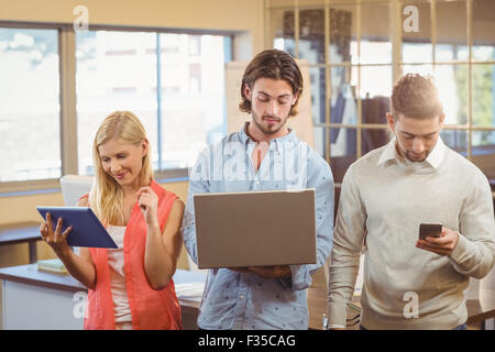 Employees using technologies Stock Photo