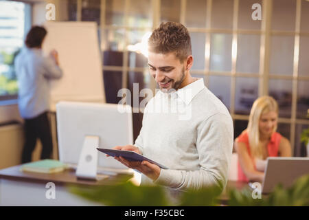 Happy businessman using digital PC Stock Photo