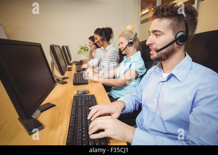 Executives working in call center Stock Photo