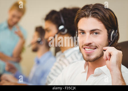 Male employee working in call center Stock Photo