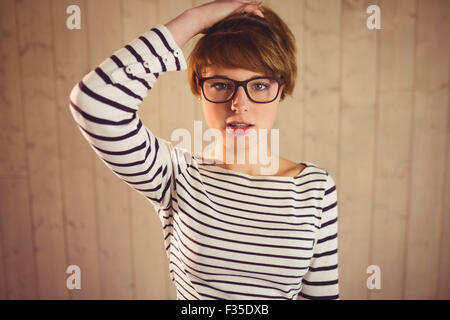 Pretty young woman with hand in hair Stock Photo