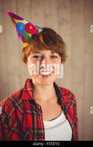 Smiling woman wearing hat party Stock Photo