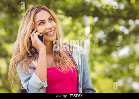 Smiling woman talking on mobile phone Stock Photo