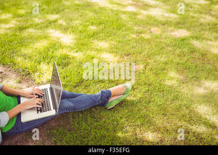 High angle view of woman using laptop Stock Photo
