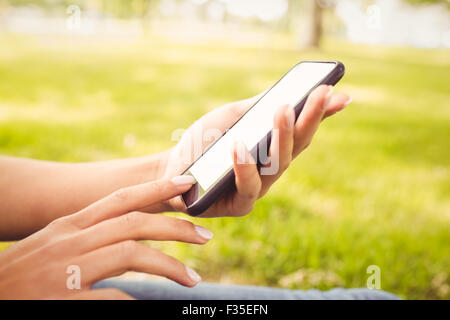 Cropped hand using smartphone Stock Photo