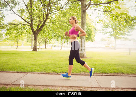 Side view of woman jogging Stock Photo