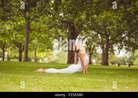 Side view of woman with eyes closed while stretching her body Stock Photo