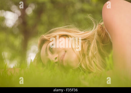 Side view of beautiful smiling woman looking away at park Stock Photo