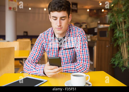 Young man using mobile phone Stock Photo