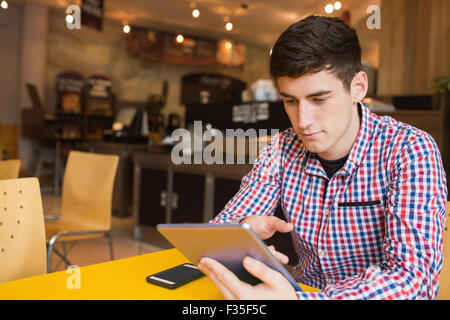 Young man using digital tablet Stock Photo