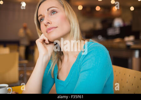 Thoughtful young woman looking away Stock Photo