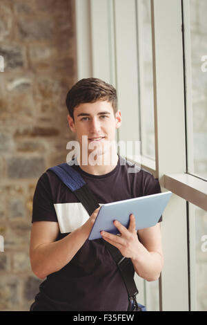 Portrait of male student using digital tablet Stock Photo