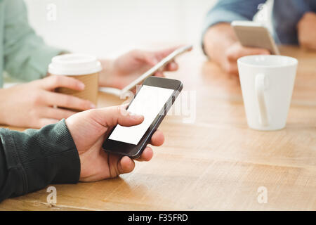 Cropped hands using smartphone Stock Photo