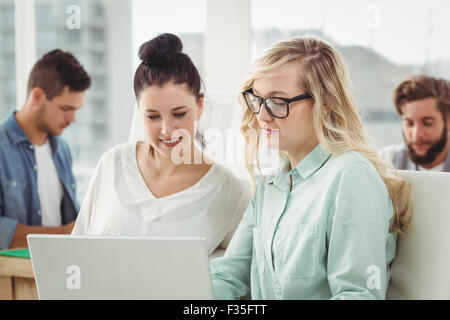 Businesswomen working on laptop Stock Photo