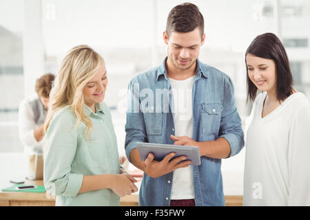Smiling Business people using digital tablet Stock Photo