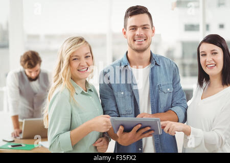 Portrait of happy Business professionals using digital tablet Stock Photo