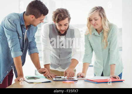 Business professionals working on digital tablet Stock Photo