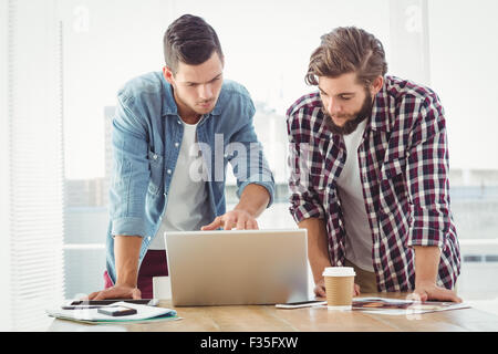 Businessmen working on laptop Stock Photo