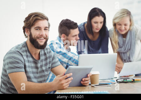 Smiling man holding digital tablet Stock Photo
