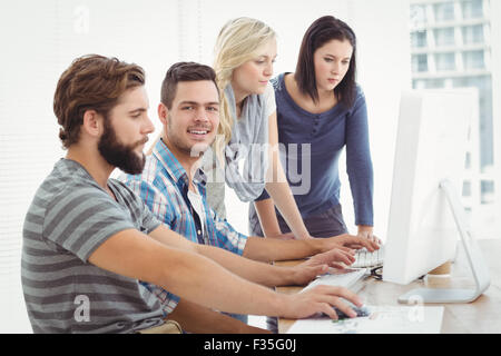 Creative business team working on computer Stock Photo