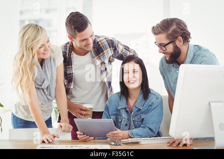 Cheerful business professionals using digital tablet Stock Photo