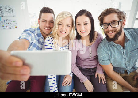 Smiling business people taking selfie Stock Photo