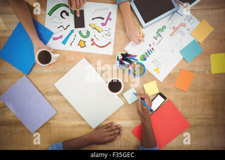 Cropped hands working at desk Stock Photo